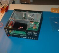 The front panel is on and the 100 watt amp is being installed.